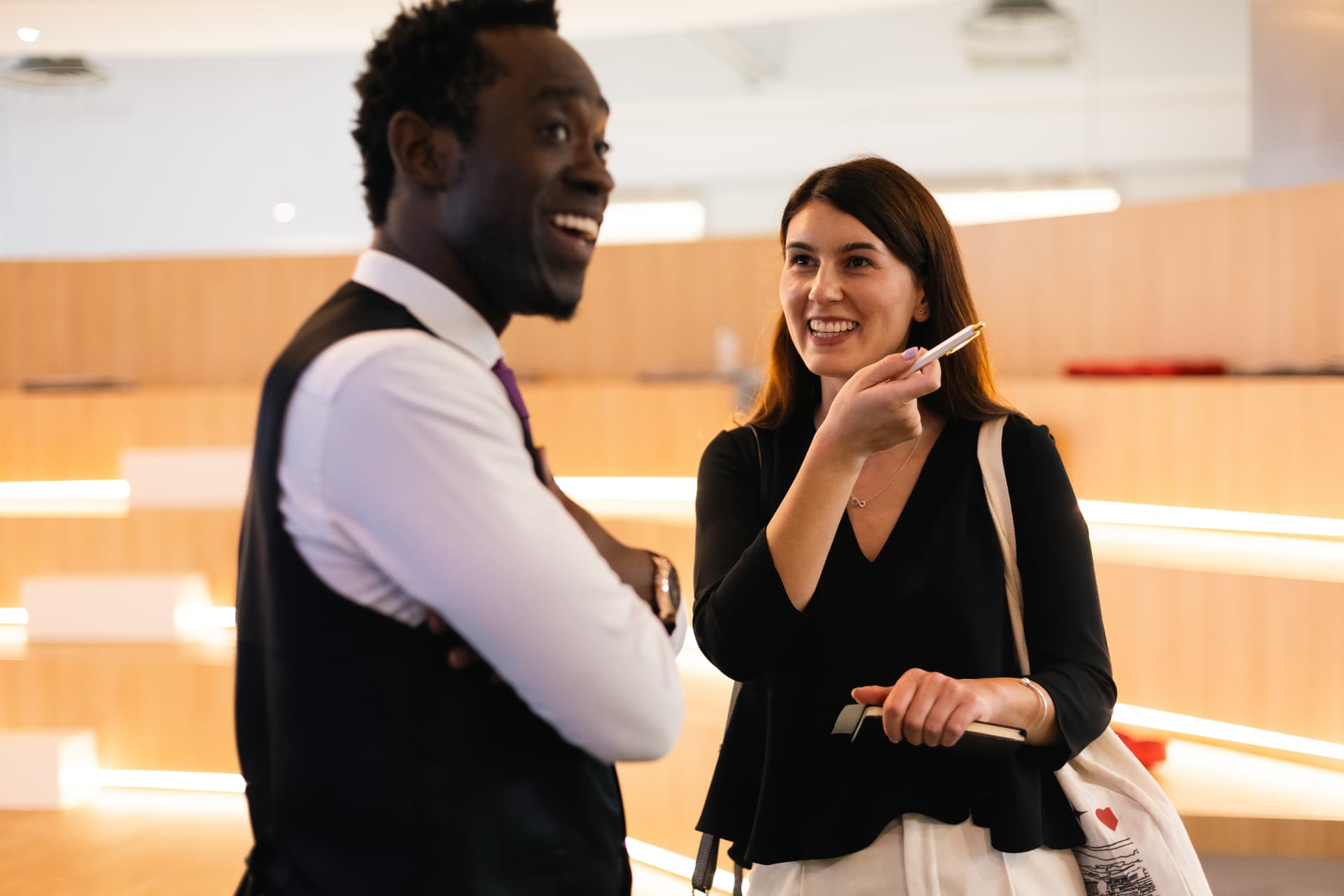 Steven Dossou in conversation with a client after a session